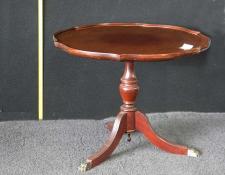 141    Mahogany brass claw foot pedestol occassional table.
Darker circle in centre where a round mat stopped the natural lightening of the colour as on the rest of the table.      $90