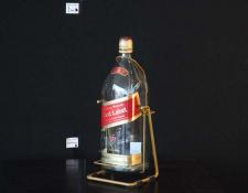 208    Johnny Walker Whisky bottle and cradle     $50